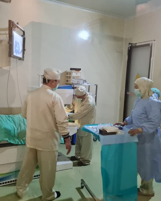 A surgical team preparing a procedure in an operating theatre at a partner hospital