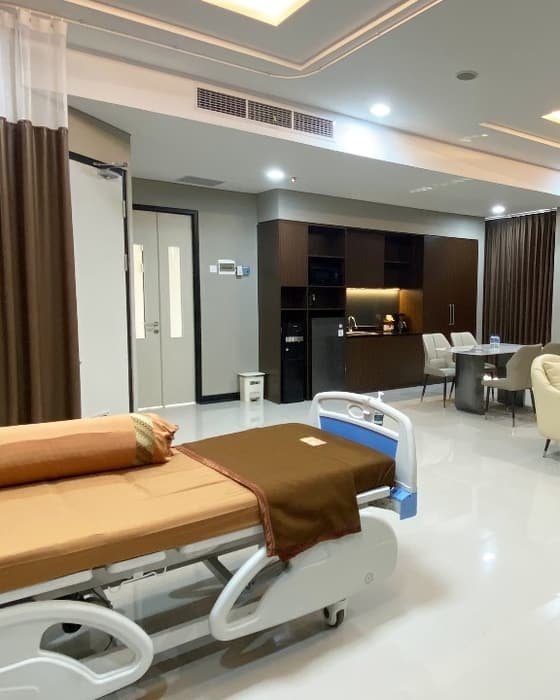 A VIP inpatient suite at a partner hospital, with a separate living area